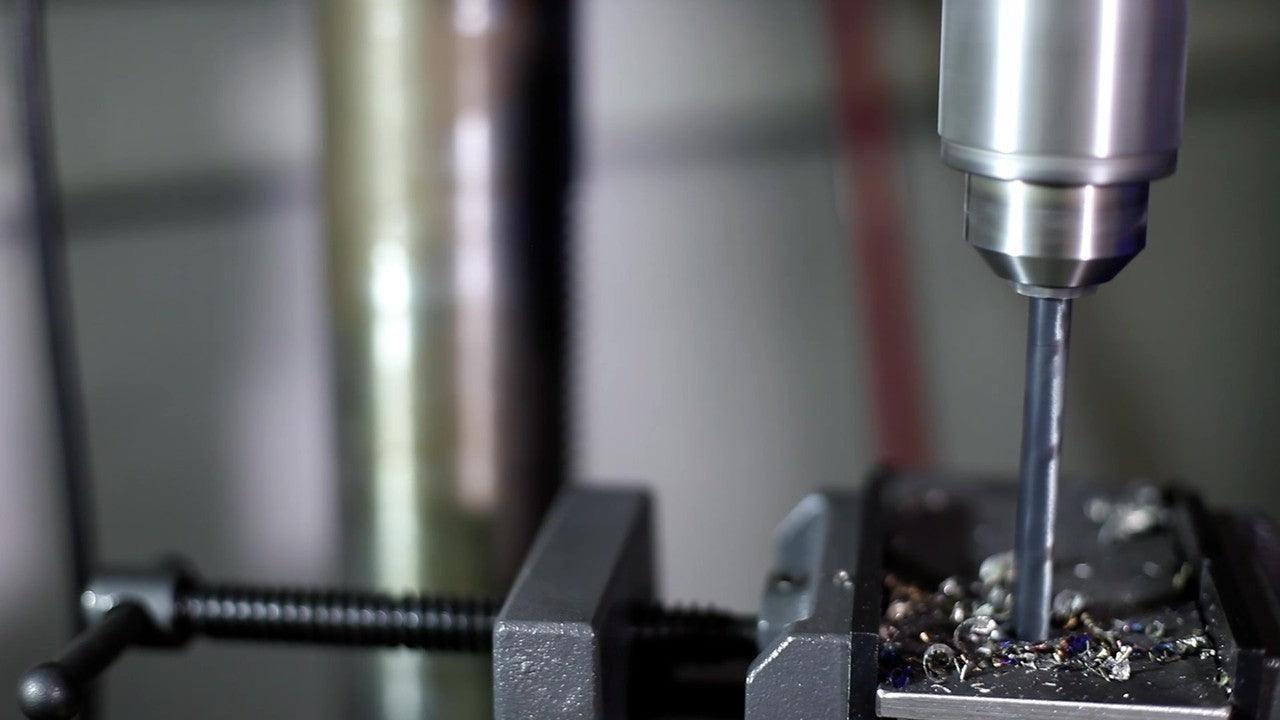 Photo of a drill being used in a machine