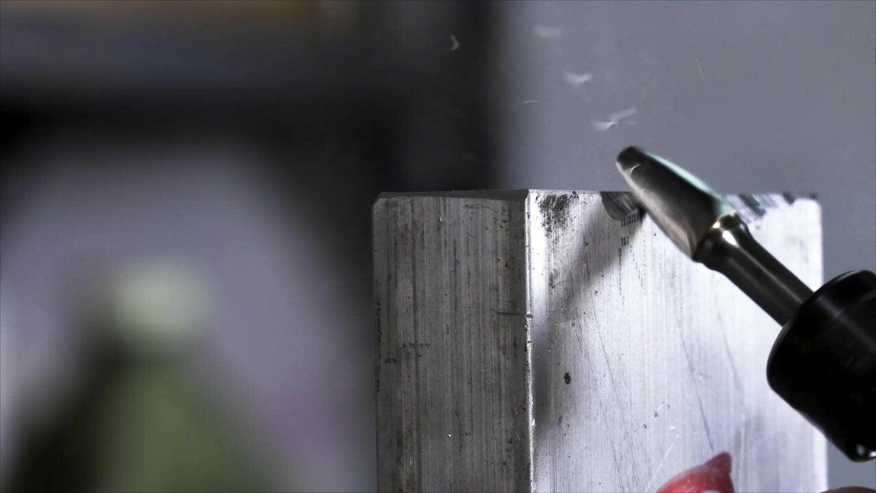 Photo of a deburring tool in a die grinder grinding metal