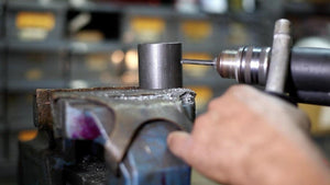 Photo of a drill being used in a hand drill