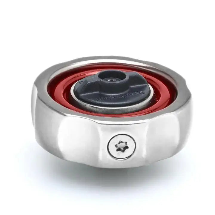 Industrial bearing with red seal and stainless steel outer ring, close-up on white background