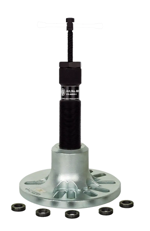 Heavy-duty industrial bearing puller tool on metal base with washers, isolated on white