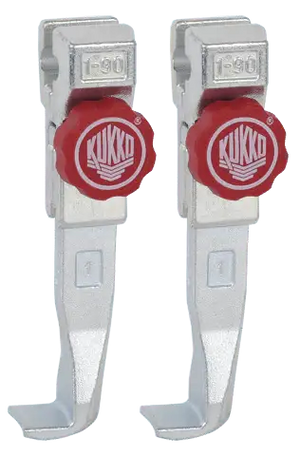 Pair of Kukko puller tool parts with red adjustment knobs and silver metal finish