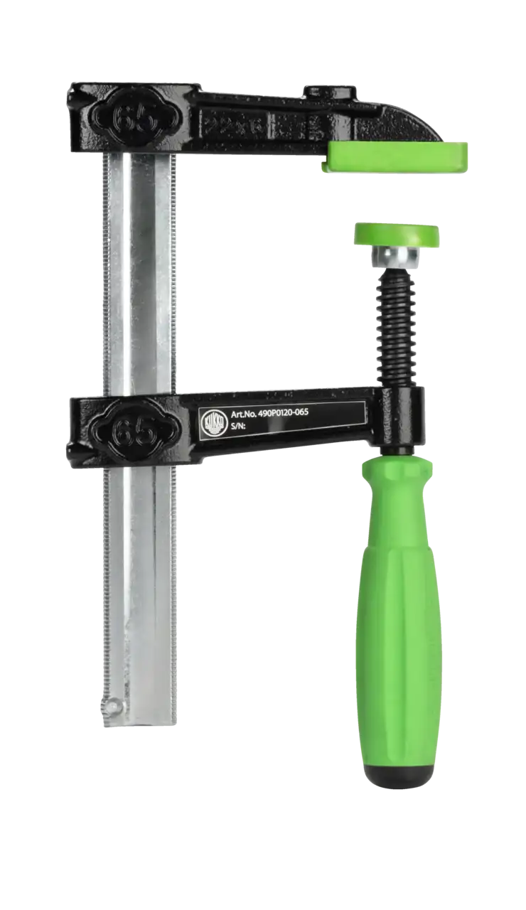 Heavy-duty F-clamp with green handle and pads for woodworking or metalworking