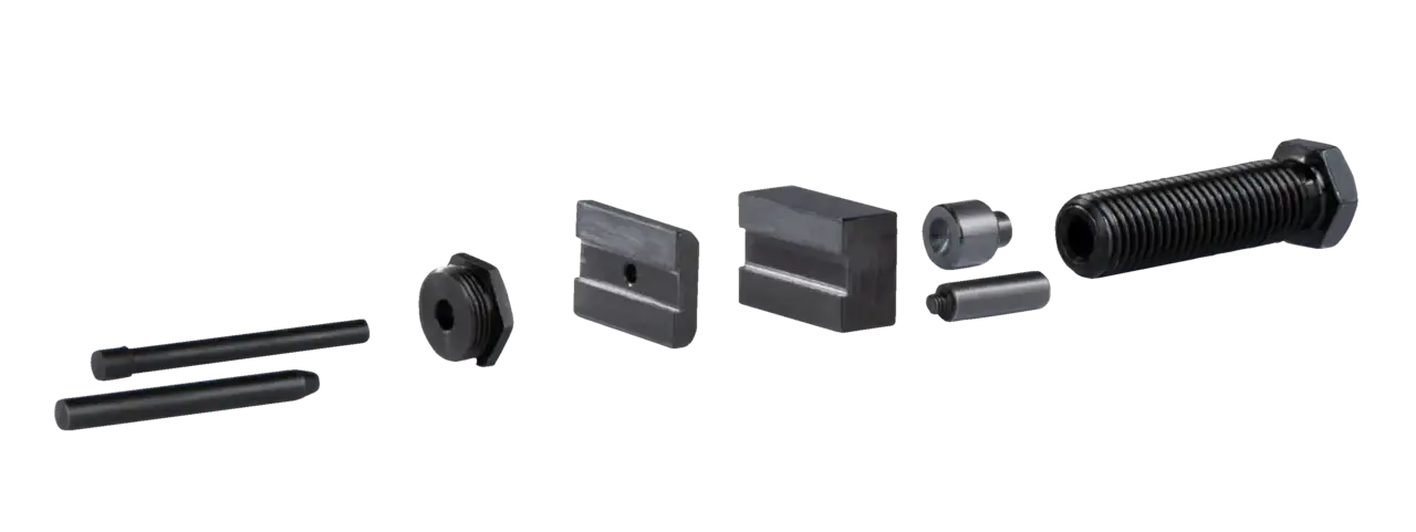 Industrial machine tool components, including threaded rod, spacers, and metal blocks