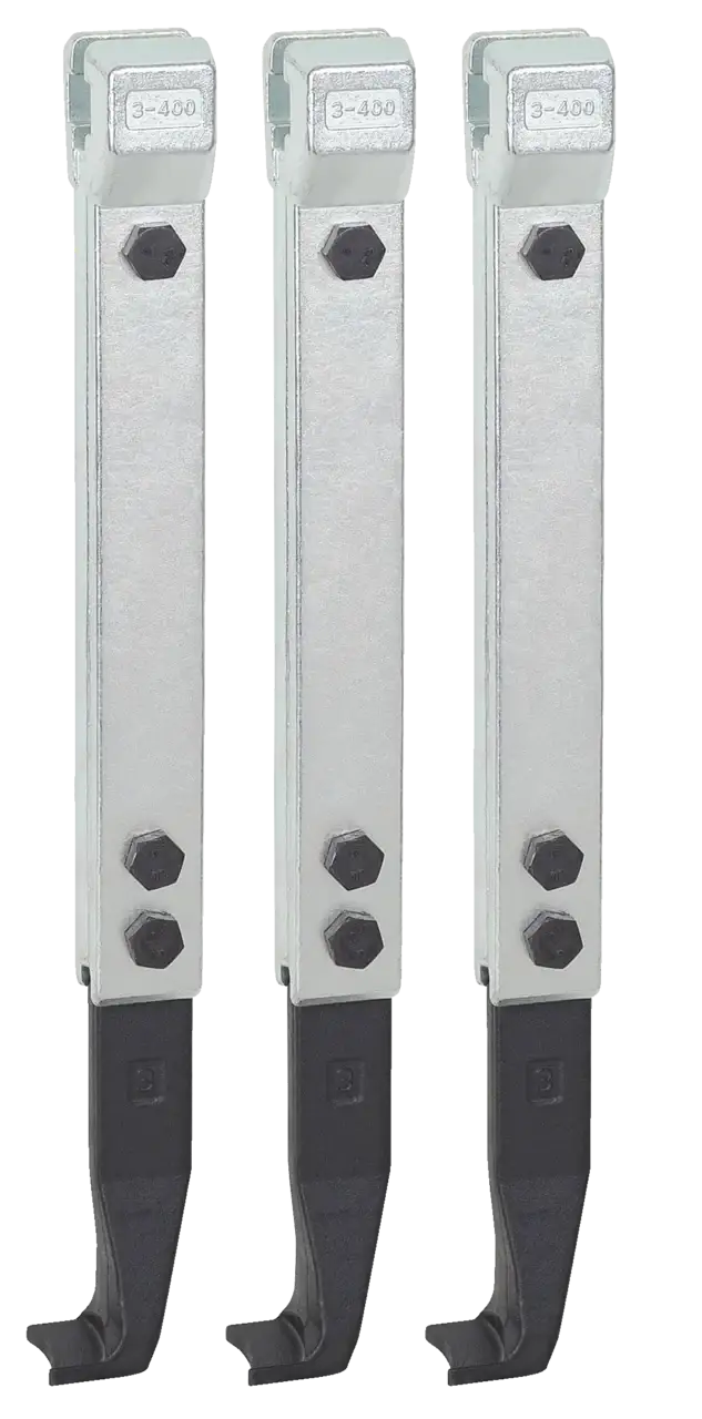 Set of three industrial metal cutting tool holders with bolts and black clamp ends