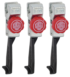 Set of three Kukko puller jaws with red adjustment knobs and metal arms for industrial tools