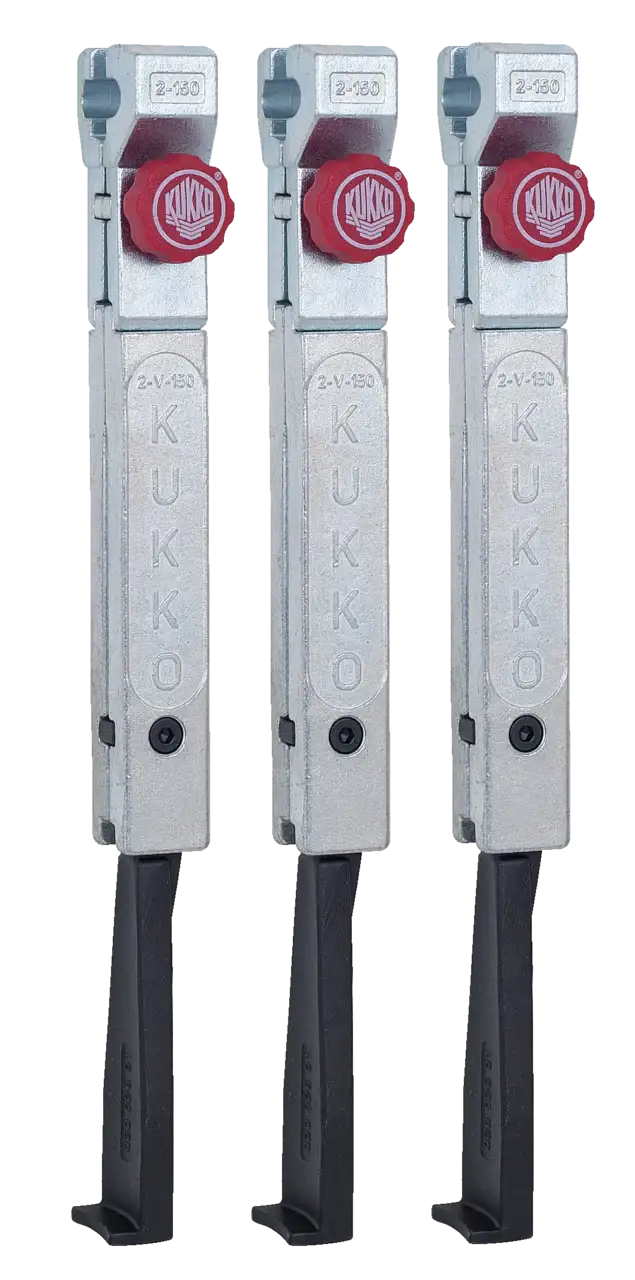 Set of three Kukko industrial puller arms with silver bodies and red adjustment knobs