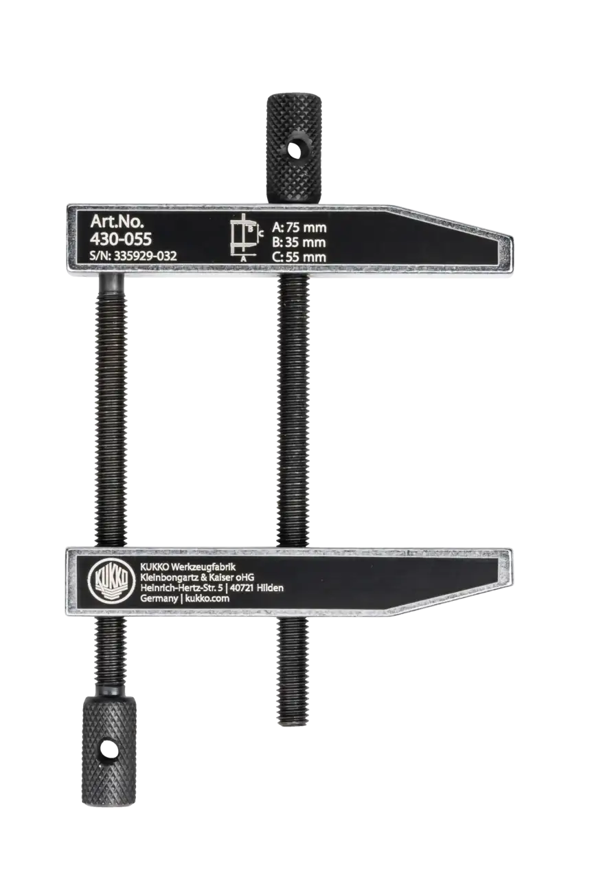 Heavy-duty adjustable metal clamp with threaded rods and measurement markings, industrial tool