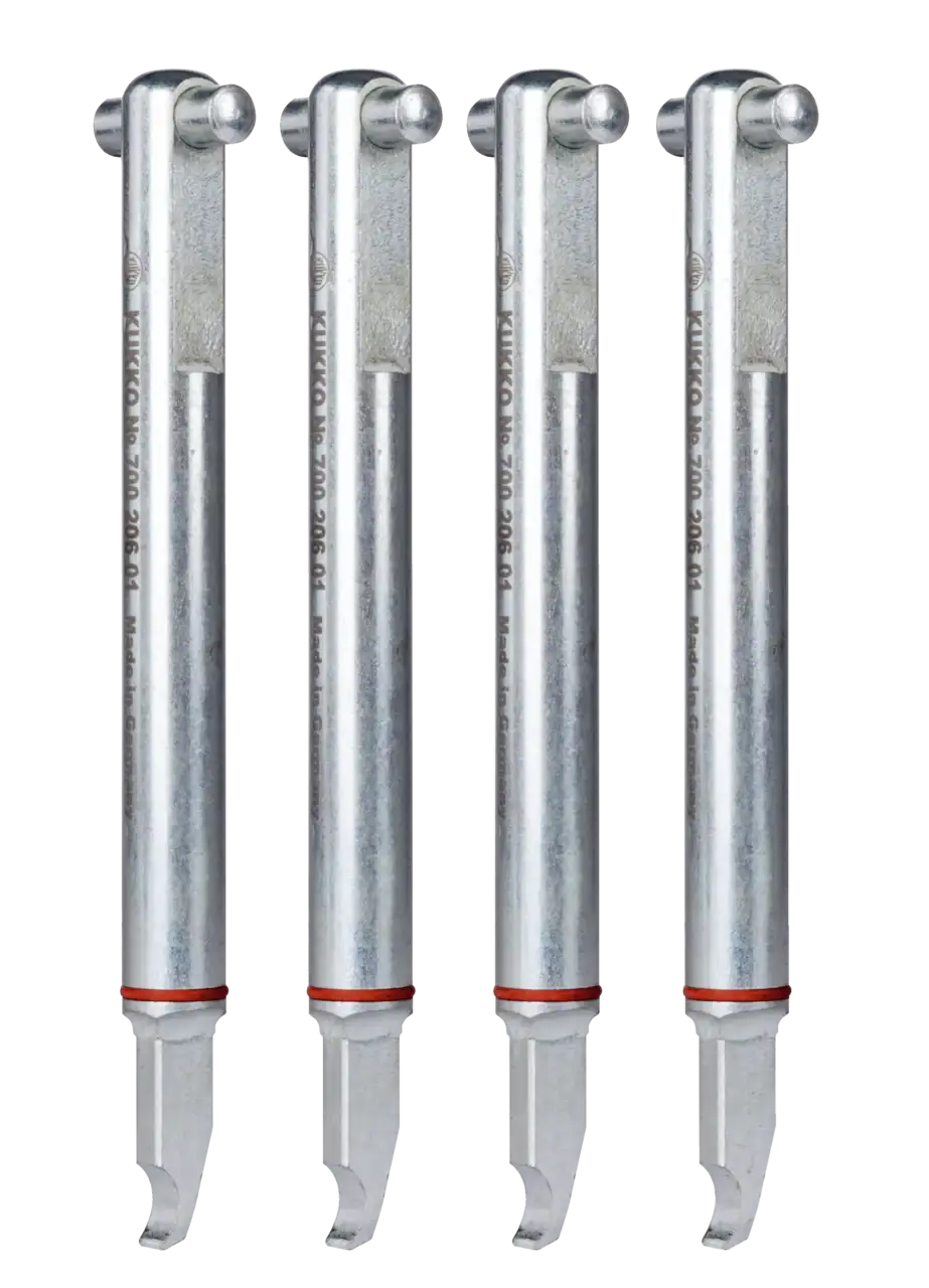 Set of four metal puller arms with cylindrical shafts for industrial tools