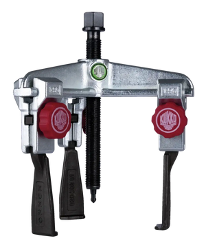 Heavy-duty gear puller tool with metal frame and red adjustment knobs, industrial use