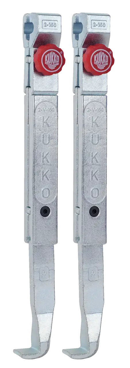 Pair of metal puller arms with red knobs, industrial hand tool, Kukko brand visible
