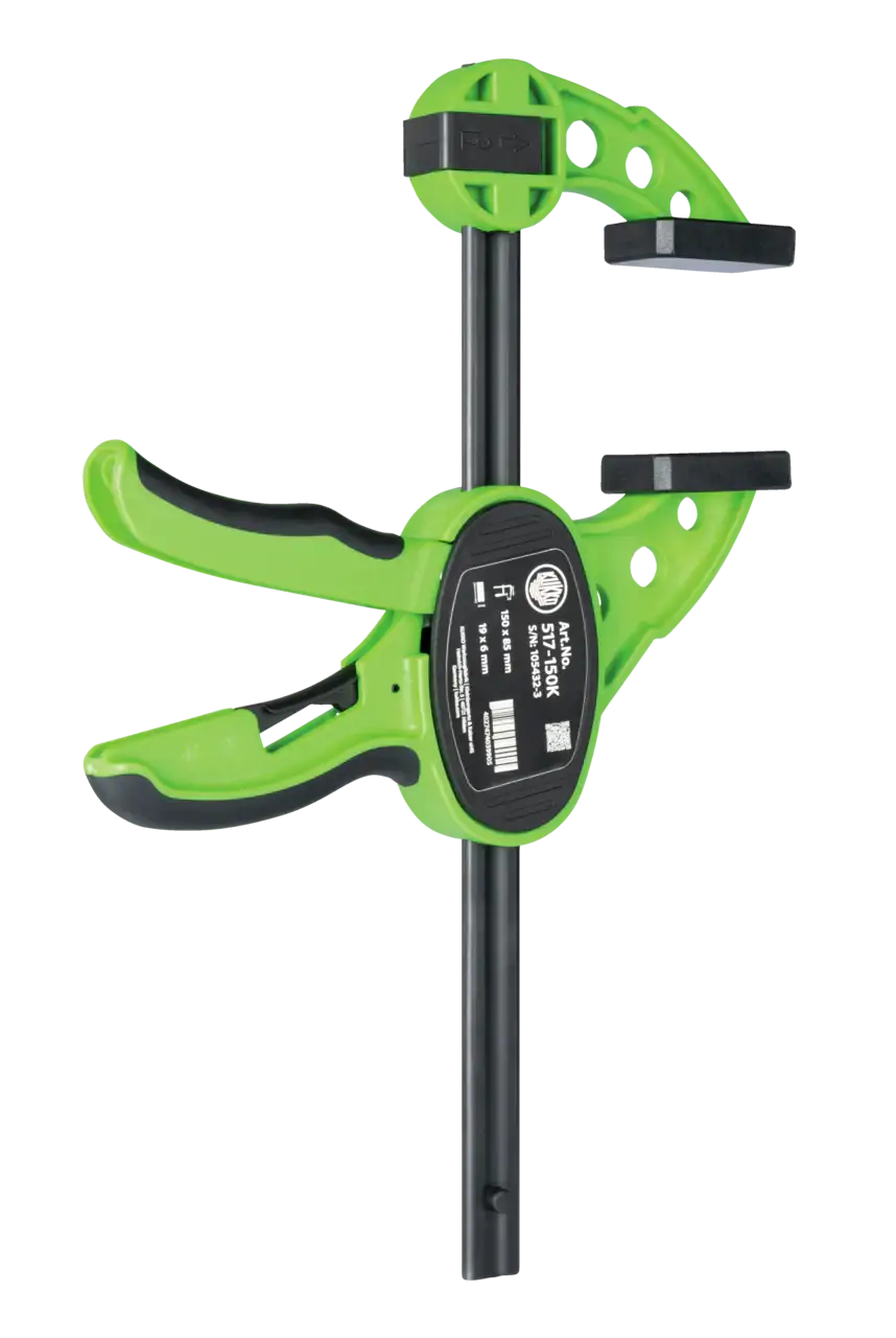 Green and black quick-release bar clamp for woodworking and shop tool applications
