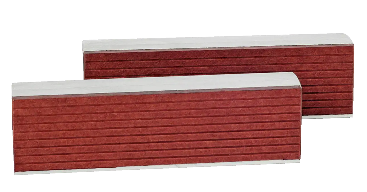 Red industrial gasket strips with grooved texture, stacked in a white metal frame
