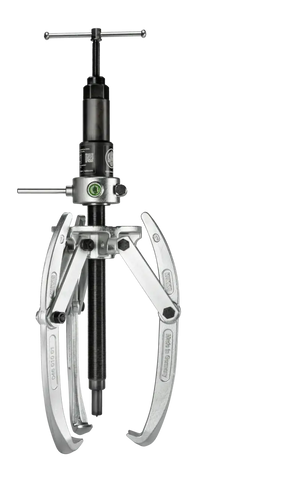 Three-jaw mechanical gear puller tool with turn handle and metallic arms, isolated on black background.