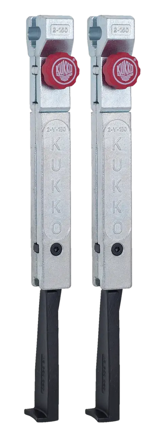 Pair of Kukko metal puller arms with red adjustment knobs, industrial tool parts