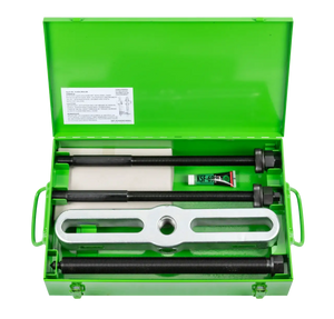 Heavy-duty industrial puller tool set in green metal case with threaded rods and accessories